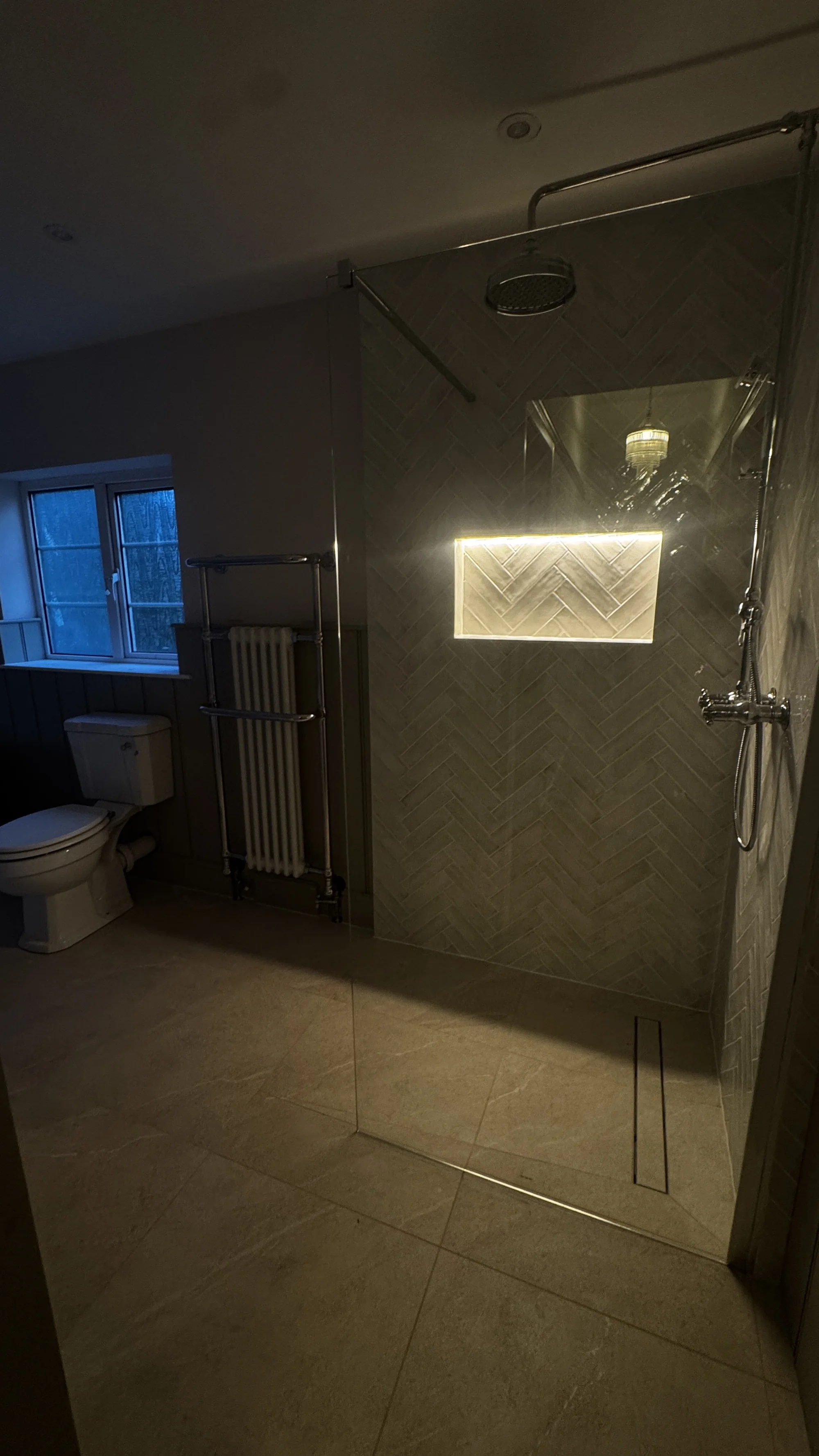 Walk-in shower, heated towel rail and window