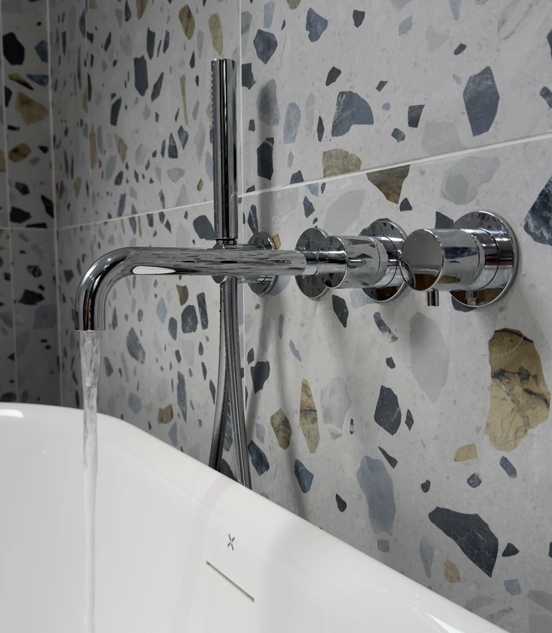 Chrome bath filler running into a freestanding bath, family bathroom Letchworth Garden City