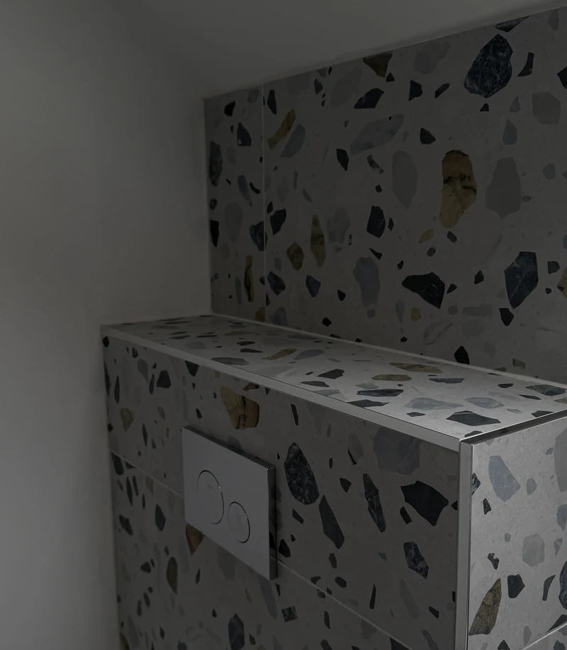 Terrazzo-tiled concealed cistern detail, family bathroom renovation Letchworth Garden City