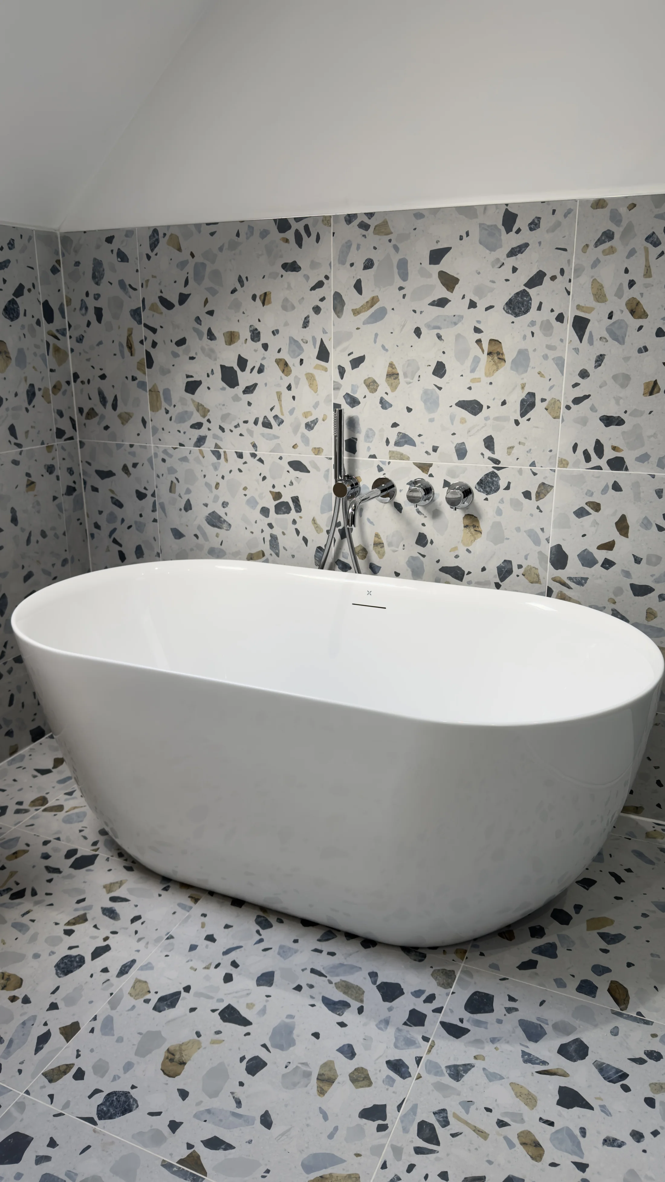 Freestanding bath and terrazzo feature wall, family bathroom renovation Letchworth Garden City