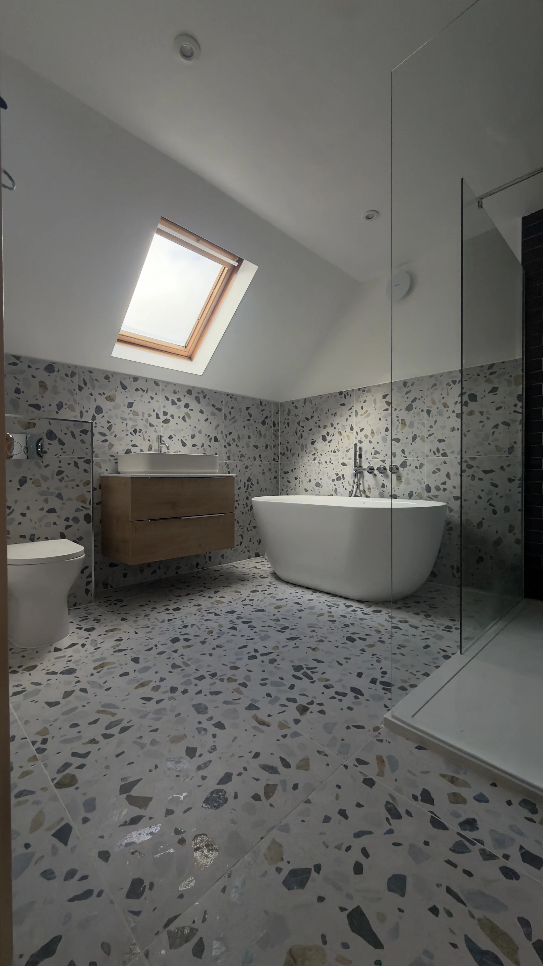 Completed loft family bathroom with walk-in shower and skylight, Letchworth Garden City