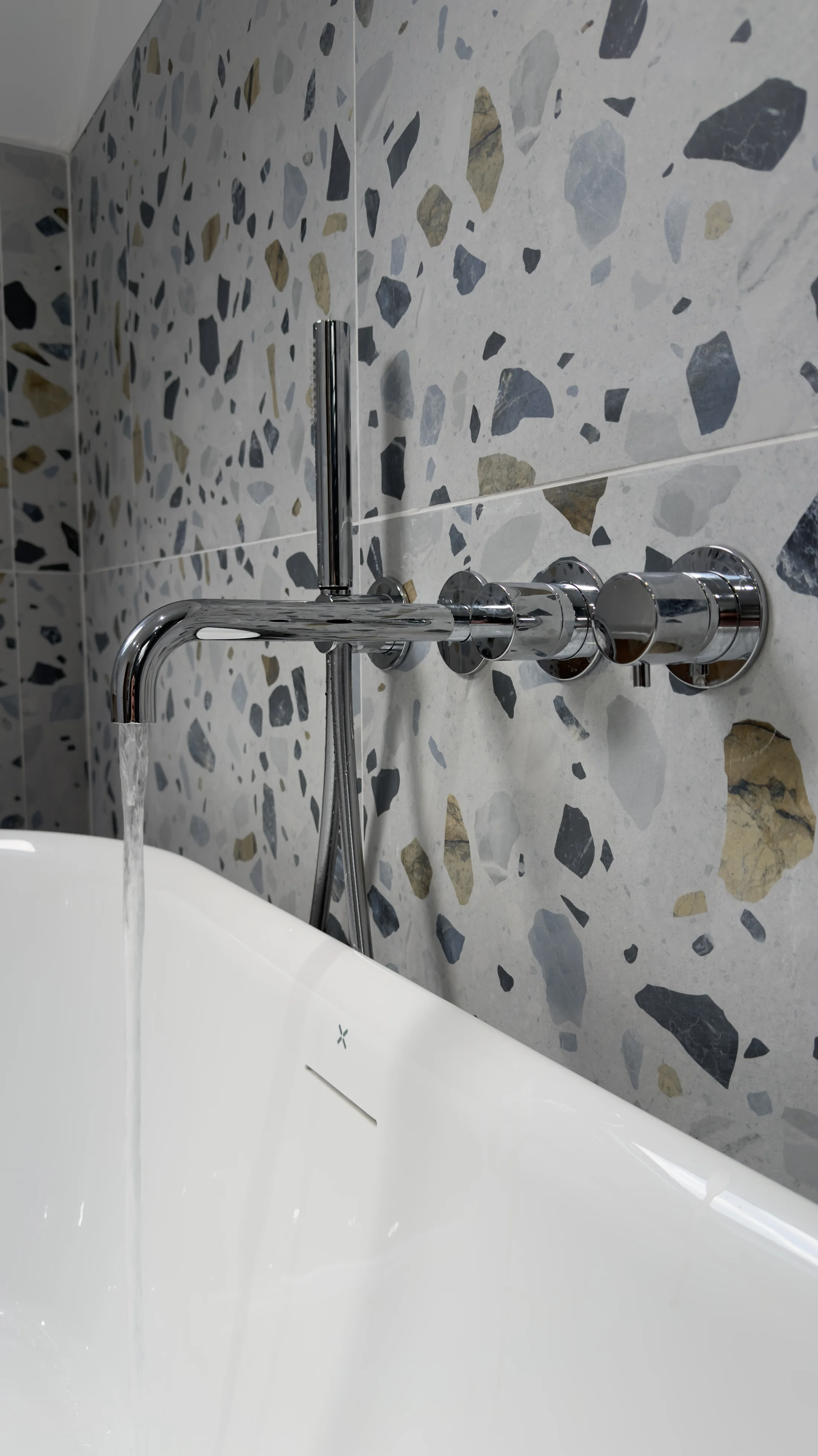 Chrome bath filler and hand shower detail, family bathroom Letchworth Garden City