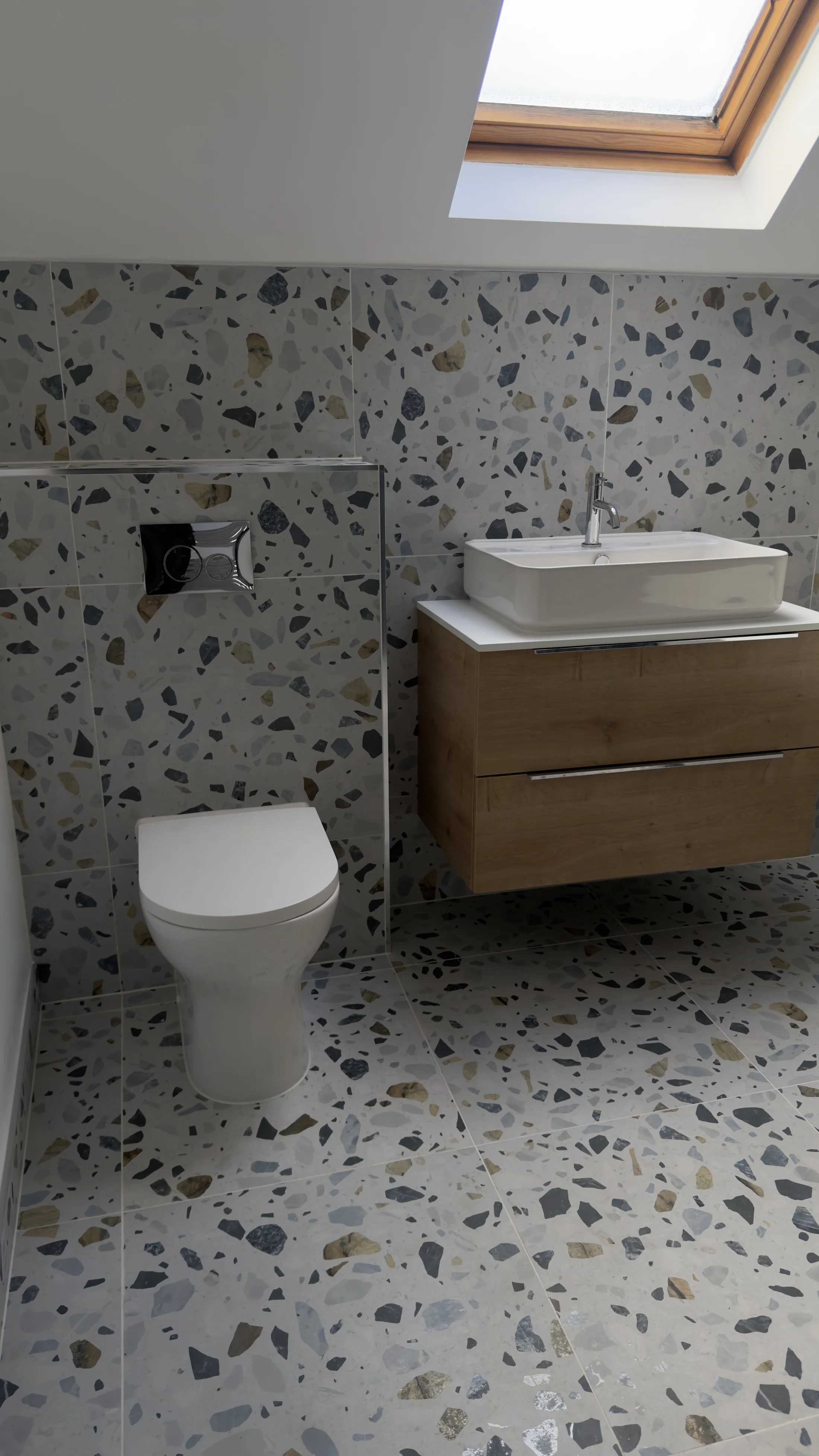 Wall-hung WC and oak vanity in terrazzo tiling, family bathroom Letchworth Garden City