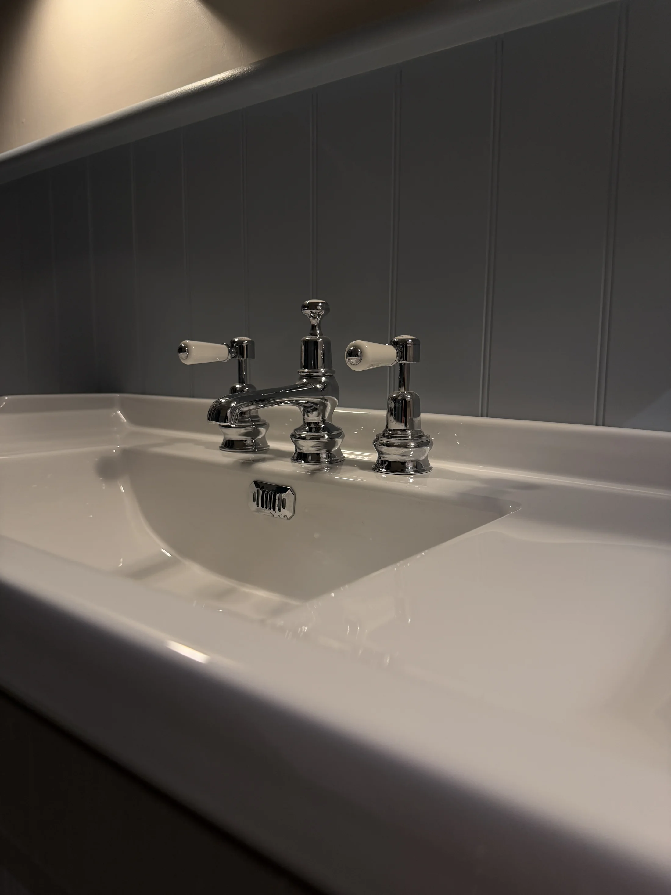 Traditional chrome crosshead taps on the basin, St Albans