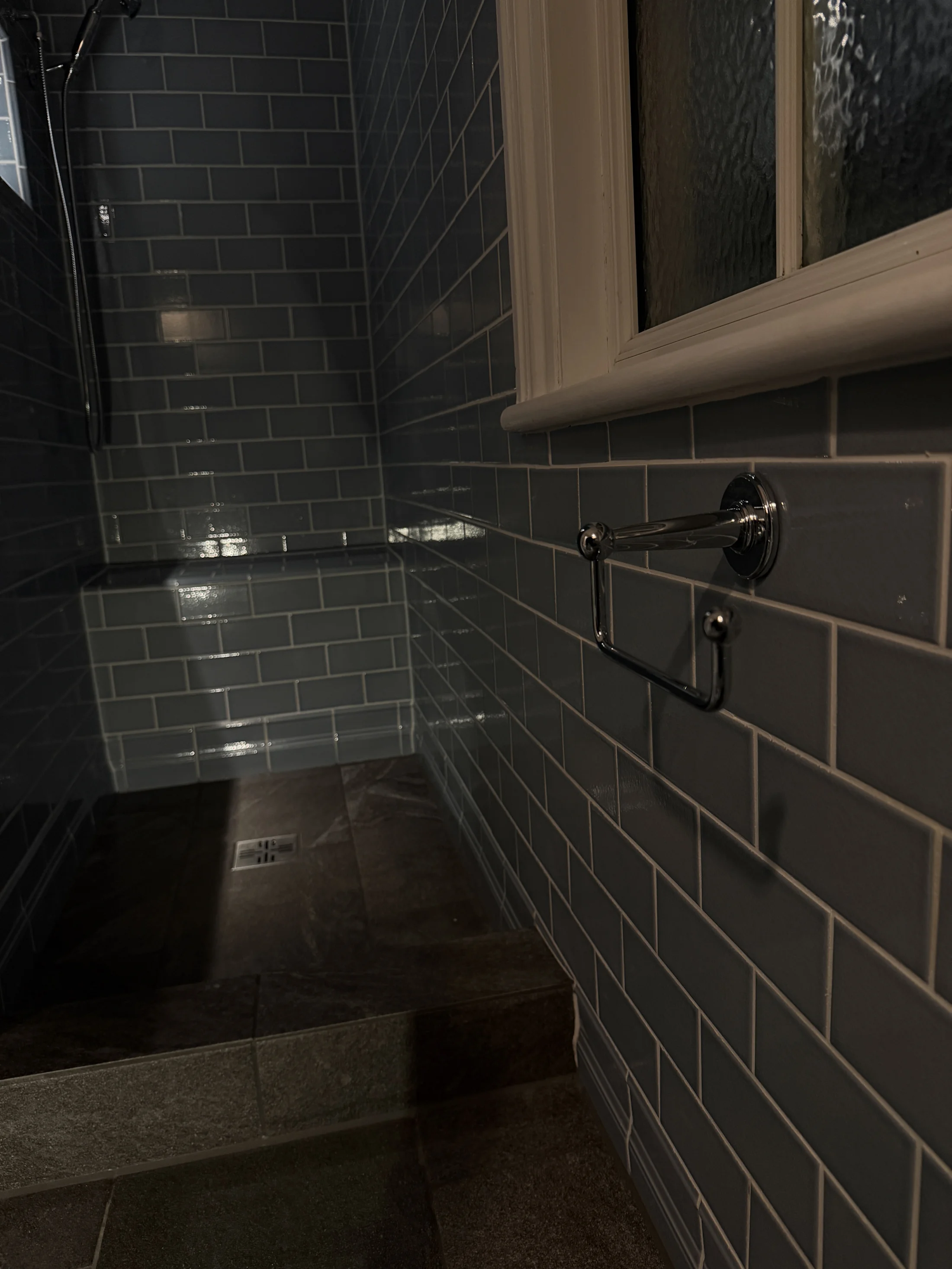 Shower area beside the window, dark metro tiling, St Albans