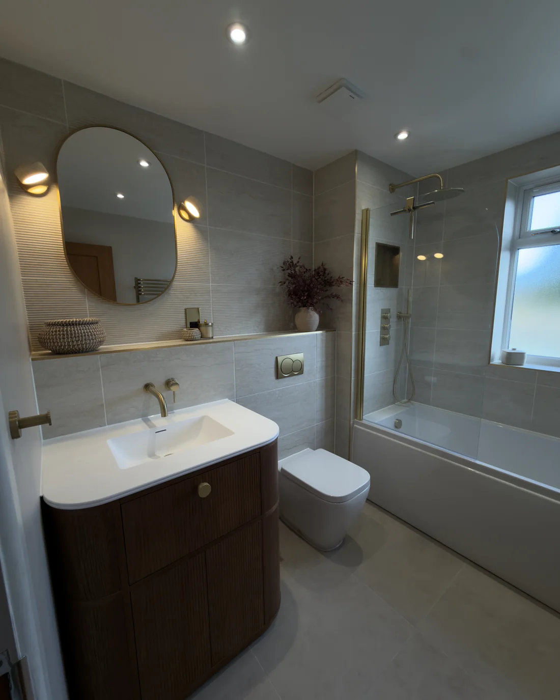 A walnut and brass bathroom renovation by JLP Plumbing & Bathrooms